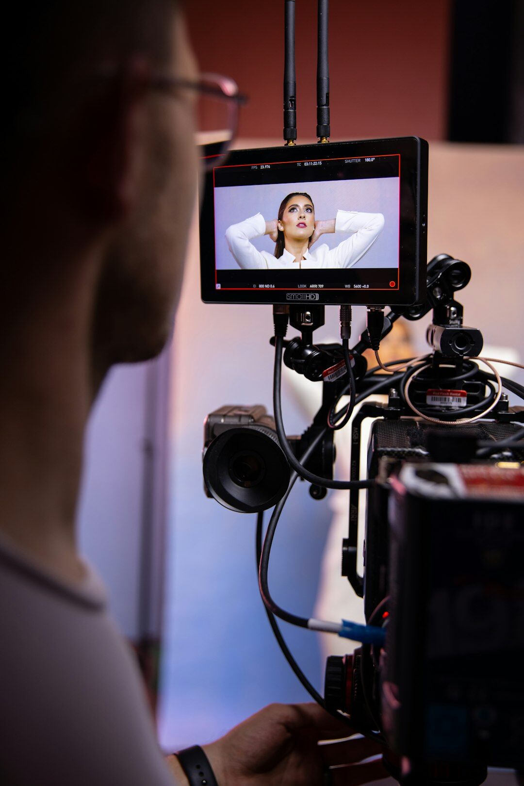 Video editor reviewing a demonstration reel on a monitor
